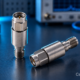 SMA fixed RF attenuator on a laboratory bench, with CentronRF watermark